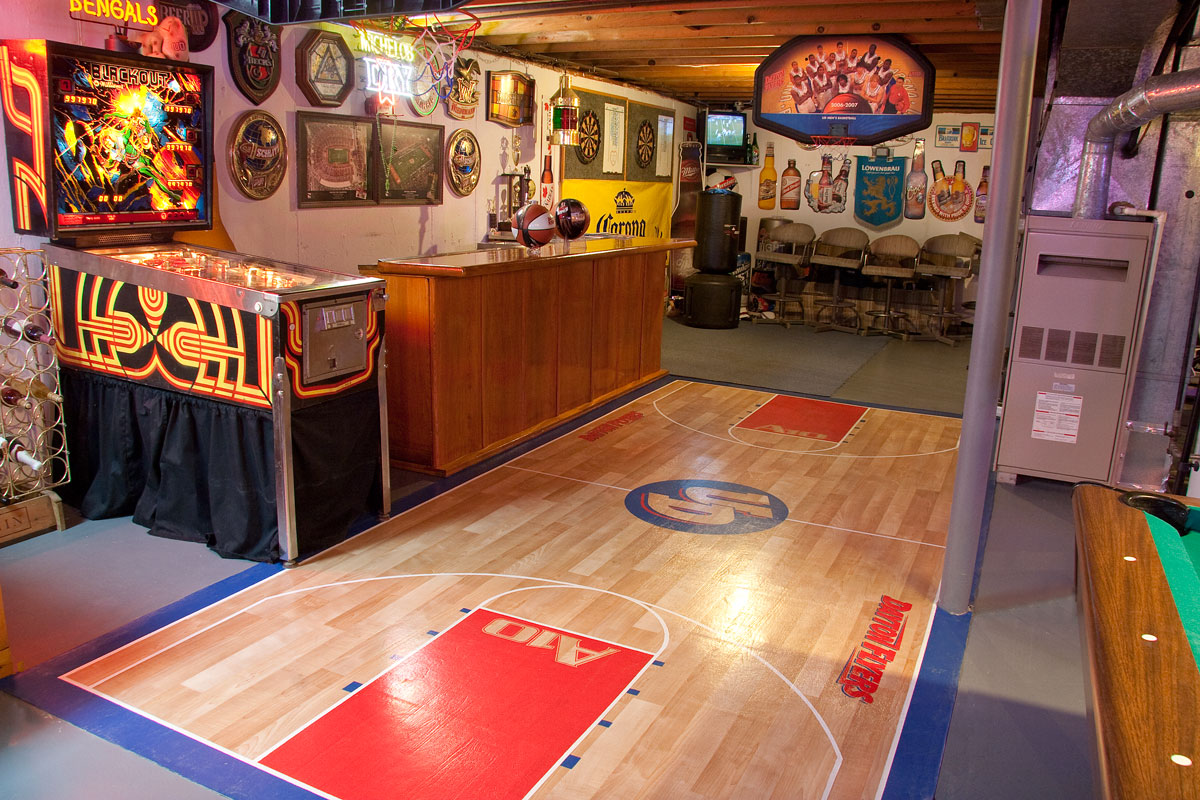 Basement arcade room with pinball machine